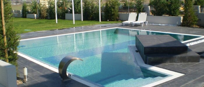 beautiful swimming pool idea with mosaic tile and overflow